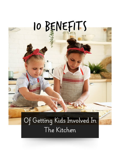 two girls baking in the kitchen wearing aprons