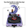 Turning the handle of the LEGO Concert Moon record player to make the vinyl and crescent moon spin
