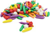 Assorted colorful plastic vegetable toys on a white background