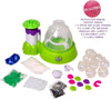 Squishy Maker slime kit with lime green and purple plastic machine, clear domes, colorful slime powders, clear TPK slime balls, curly ribbons, sparkles, and an instruction manual on a white background.