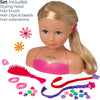 A doll hair styling set displayed on a white background, featuring a blonde doll bust with blue eyes, pink top, and a pink hair accessory, surrounded by included items: a pink hairbrush, pink hair clips and beads, a red braided hair extension, a purple braided hair extension, and a pink styling head. Text in the upper left lists included items.