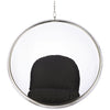 A modern hanging bubble chair with a clear circular acrylic or glass shell, a polished silver metal frame, and a black cushioned seat, suspended by a chain against a white background.
