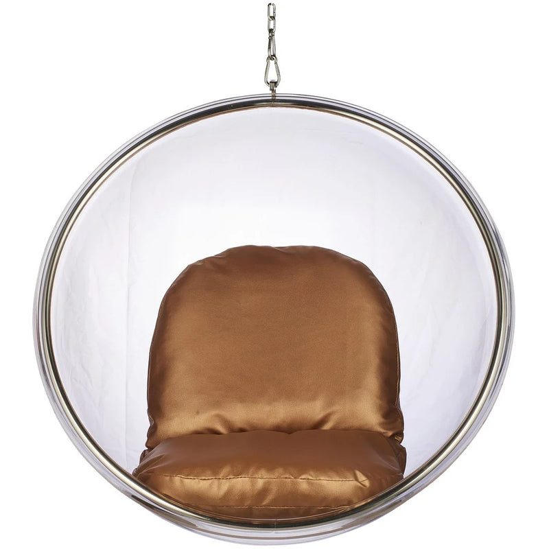 A modern hanging bubble chair with a clear acrylic or glass spherical shell, a polished silver metal frame, and a plush cushioned seat and back in a warm brown satin fabric, suspended by a chain against a plain white background.