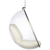 A modern clear hanging egg chair with cream-colored cushions and a chrome metal frame, suspended by a chain against a plain white background.