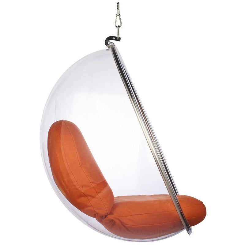 A modern hanging egg chair with a clear transparent plastic shell, a metallic silver support pole, and an orange cushioned seat and backrest, suspended by a chain against a white background.