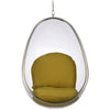 A modern egg-shaped hanging chair with a clear transparent shell and a mustard yellow cushioned seat and backrest, suspended by a metal chain against a plain white background.
