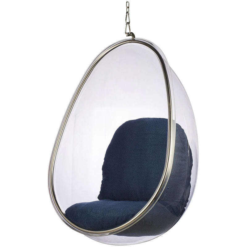 A modern teardrop-shaped hanging egg chair with a clear transparent outer shell, a silver metal frame, and dark navy blue padded seat and back cushions, suspended by a chain against a plain white background.