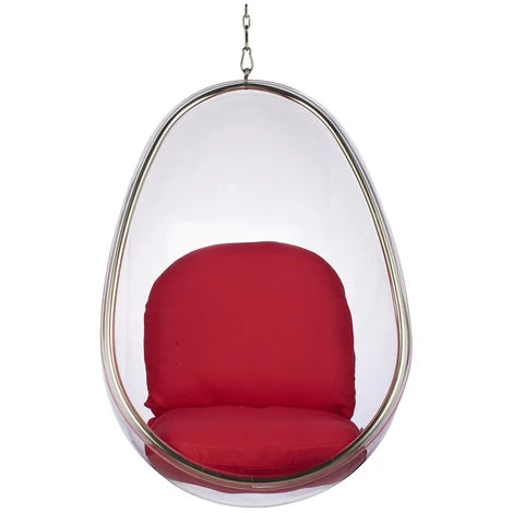 A modern egg-shaped hanging chair with a clear transparent outer shell and a red cushioned seat and backrest, suspended by a metal chain against a white background.
