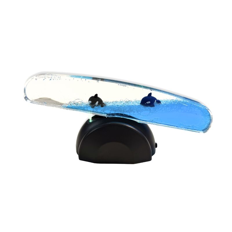 Light Up Whale Seesaw tilted with the right end lowered, showing whales floating in blue liquid