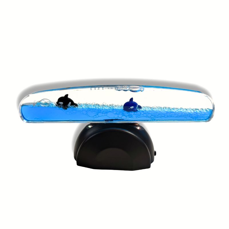 Light Up Whale Seesaw in a level position with two floating whales and a black base