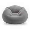A modern, low-profile bean bag chair in a solid medium gray fabric, shown from a front-facing perspective on a clean white background.