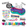 Toy set with colorful beads, noodles, and squishies on a white background